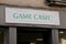 Game Cash  text logo and brand store street sign of cash converting pawn shop