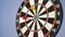 A game of darts. Throwing darts at the target. And someone will throw darts on a dartboard. A dartboard hanging on a