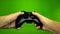 Game player hands controlling joystick keys playing on green screen