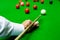 Game snooker billiards or opening frame player ready for the ball shot, athlete man kick cue on the green table in bar