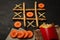 Game of tic tac toe of french fries and carrot. Choosing healthy vs unhealthy foods. Fit or fat concept