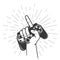 Gamepad palmed in gamer hand with pointing finger gesture, retro game controller or joystick squeezed in hand