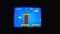 Gameplay of the popular video game Super Mario Bros. Retro video game for Nintendo 80s on the screen of an old TV in a