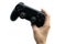 Gamer hand holding black joystick on white background. Concept cybersport