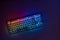 Gaming keyboard with RGB light. White mechanical keyboard. Gamer`s workspace, neon light