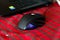 Gaming mouse on a Christmas red background.