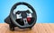 Gaming steering wheel on the wooden table. 3D rendering