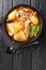Gamjatang Pork Bone Korean Soup close up in the bowl. Vertical top view