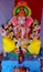 A Ganesh idol made of plaster of Paris and decorated with garlands