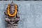 Ganesha sitting in meditating yoga pose in hindu temple