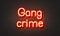 Gang crime neon sign on brick wall background.