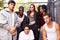 Gang Of Young People In Urban Setting Standing By Fence