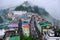 Gangtok, Sikkim - June 16 2022, Tourists enjoy a ropeway cable car ride over Gangtok city. Amazing aerial cityscape of Sikkim.