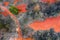 Gant, Hungary - Aerial horizontal drone view of abandoned bauxite mine with warm red and orange colors