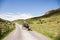 Gap of Dunloe, Ireland - people enjoying a horse carriage ride next to Augher lake in county Kerry