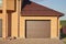 Garage with automatic garage door attached to the house