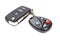 Garage door remote control with closed ignition key on a white b