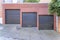 Garage exterior with three black canopy doors at San Francisco, California