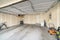 Garage interior with wall filler marks and white fire door