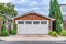 Garage in San Diego California with white door and brown wall under gable roof