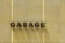 Garage sign with shadow of letters