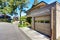 Garage space of large beige house .