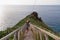 Garajau - Mother holding daughter on wooden staircase from Cristo Rei statue to cape at Garajau, Canico, Madeira island