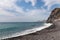 Garajau - Panoramic view of idyllic volcanic black stone beach of Praia Garajai, Canico, Madeira island, Portugal, Europe
