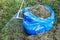 Garbage bag with raked grass. Lawn raking