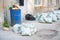 Garbage in bags and barrels on streets