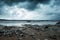 Garbage on beach, environmental pollution in Bali Indonesia. Storm is coming. And drops of water are on camera lens