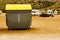 Garbage bin and campers on coast in Spain