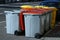 Garbage bins on the street after being emptied by the waste collection truck.