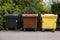 Garbage cans in a row. Separate waste collection.