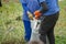 Garbage collection. People carry a white construction bag full of rubbish