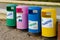 Garbage in colored trash cans with sorted garbage icons. plastic, paper, metal, glass. Sorting garbage by material and
