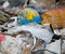 Garbage dump. Broken terrestrial globe in the garbage