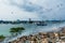 Garbage dump near harbor view full of smoke, litter, plastic bottles,rubbish and trash at the Thilafushi local tropical island