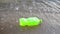 Garbage in the form of a plastic bottle floats in the river, lake close-up. Environmental pollution