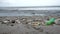 Garbage on the ocean. Beach polluted with plastic bottles