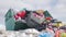 Garbage is pile lots dump, many garbage plastic bags black waste at walkway community village, bags bin of plastic waste