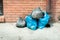 Garbage plastic bags full of junk dumped on the street waiting for dumpster truck to collect them