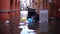 Garbage and plastic trash cans float on water after flood