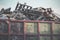 Garbage removal. Pile of wooden pallet waste on background blue sky