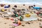 Garbage on sea beach, dirty ocean water, environmental pollution, ecology, waste, rubbish, plastic, trash, refuse, litter