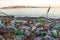 Garbage on the shore of the Japanese sea. Empty used dirty plastic bottles on the beach of the big city.