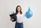 Garbage Sorting. Smiling Woman Holding Waste Bag And Bucket With Plastic Bottles