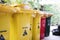Garbage trash bins, separate wet, danger, dry and recycle waste, selective focus shallow depth of field