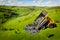 Garbage truck dumps plastic waste and packages onto clean green field. Concept pollution of environment, man poisons