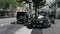 Garbage Truck in NYC and two DSNY workers Loading Black Garbage Trash Bags into Truck. Manhattan